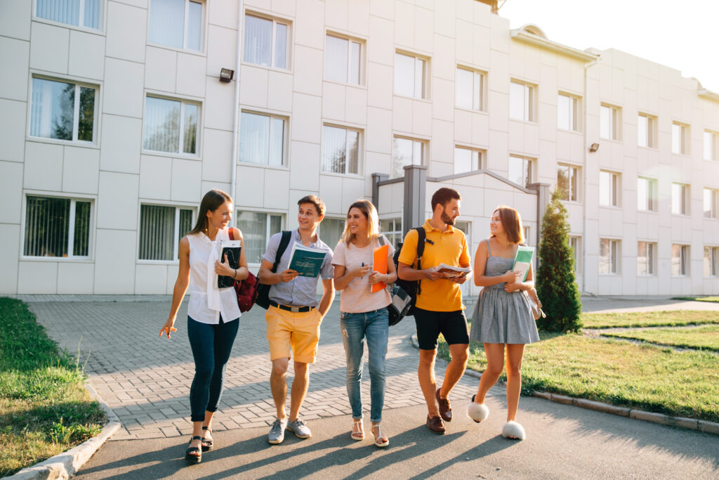 free time students bachelor s campus life rhythm five friendly students are walking